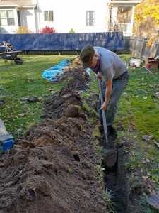 Digging trench to bring solar power to the house