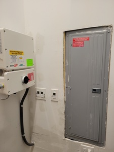 Inverter next to electrical service panel