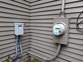 Solar AC disconnect next to utility meter