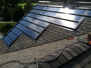 Solar shingles on the West part of the roof