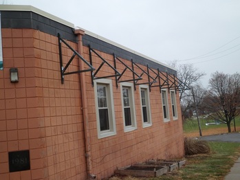Awning frames on SouthWest wall