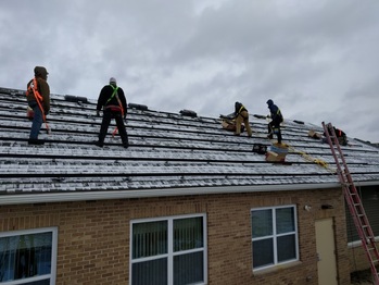 Installing the rails on a snowy roof