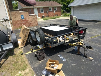 Hauling panels onto the roof