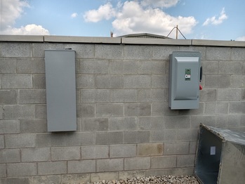 Solar combiner box and AC disconnect