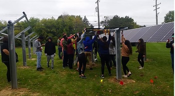 Students installing the panels