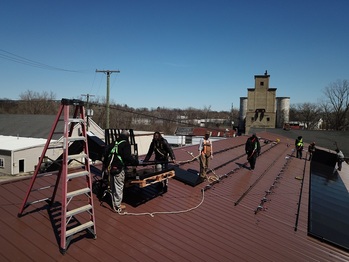 Expansion: Unloading panels on the roof
